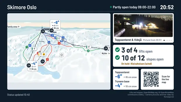 The base-area TV: the map beside the lift-hut board